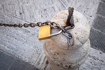Image showing Chain with a lock on a stone pillar