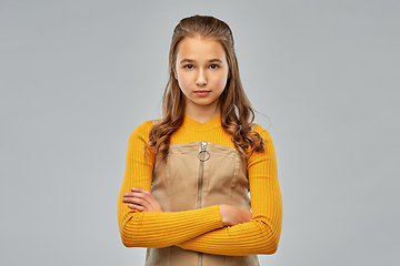 Image showing serious young teenage girl with crossed arms