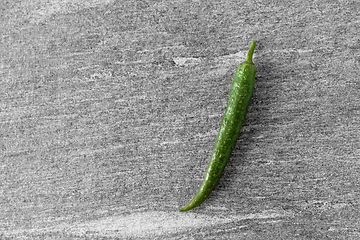 Image showing green chili pepper on slate stone background