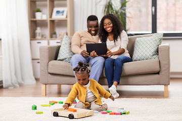 Image showing family with tablet pc and toy blocks at home