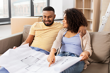 Image showing couple with boxes and blueprint moving to new home