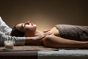 Image showing woman having face and head massage at spa