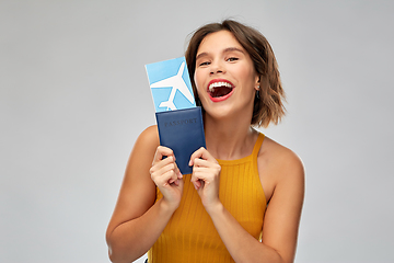 Image showing happy young woman with air ticket and passport