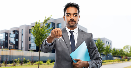 Image showing indian man realtor with home keys on city street