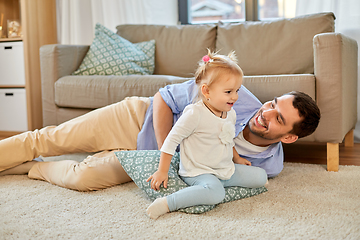 Image showing father with little baby daughter at home