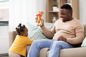 Image showing african american father playing with baby at home