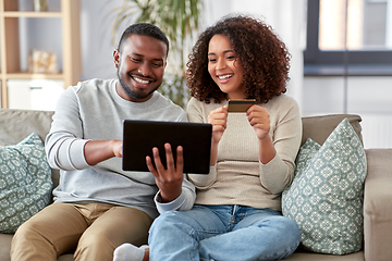 Image showing couple with tablet pc and credit card at home