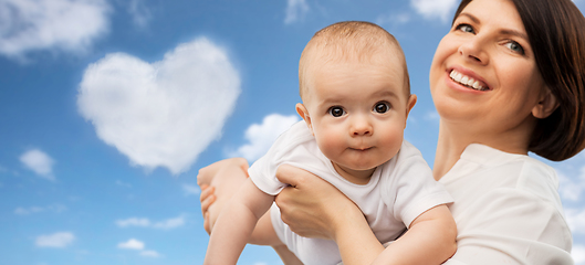 Image showing happy middle-aged mother with little baby daughter