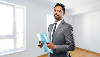 Image showing indian man realtor with folder at new apartment