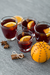 Image showing glasses of mulled wine with orange and cinnamon