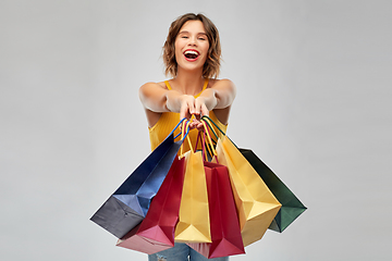 Image showing happy smiling young woman with shopping bags