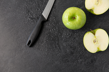 Image showing green apples and kitchen knife on slate background