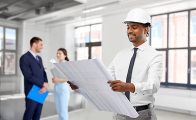 Image showing indian male architect in helmet with blueprint