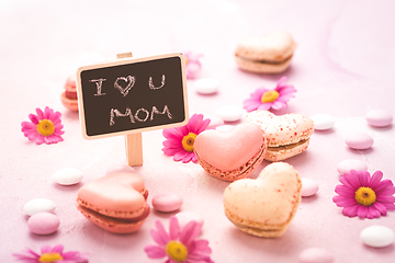 Image showing Happy Mothers Day - sweet macarons in heart shape with flowers