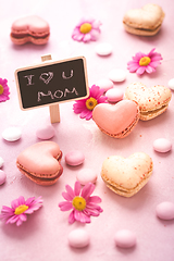 Image showing Happy Mothers Day - sweet macarons in heart shape with flowers