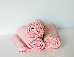 Image showing pink bath towel rolls
