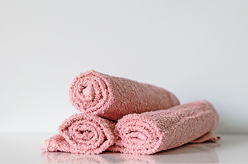 Image showing pink bath towel rolls