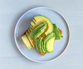 Image showing toasted bread with sliced avocado