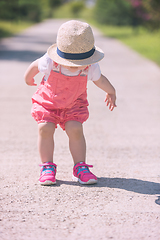 Image showing little girl runing in the summer Park