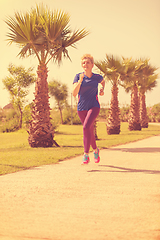 Image showing young female runner training for marathon