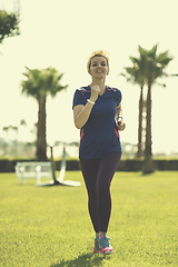 Image showing young female runner training for marathon