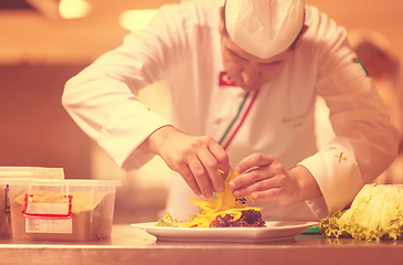 Image showing chef serving vegetable salad