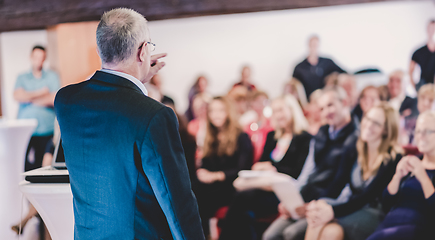 Image showing Speaker at Business Conference with Public Presentations. Audience at the conference hall.