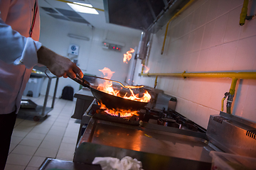 Image showing Chef doing flambe on food