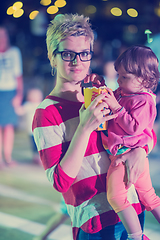 Image showing mother and little daughter in the kids disco