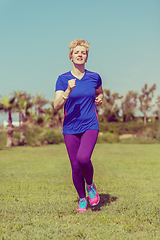 Image showing young female runner training for marathon