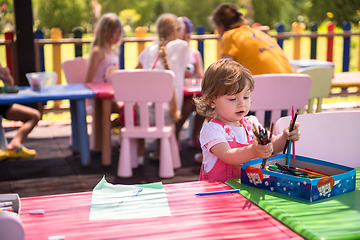 Image showing little girl drawing a colorful pictures