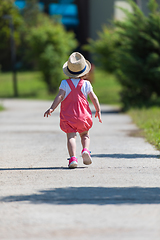 Image showing little girl runing in the summer Park