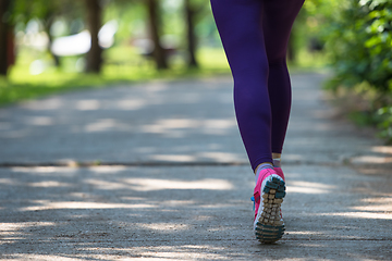 Image showing young female runner training for marathon