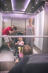 Image showing happy family in the elevator