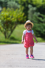 Image showing little girl runing in the summer Park