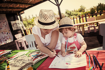 Image showing mom and little daughter drawing a colorful pictures