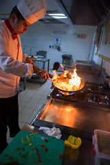 Image showing Chef doing flambe on food