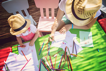 Image showing mom and little daughter drawing a colorful pictures