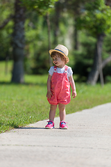 Image showing little girl runing in the summer Park