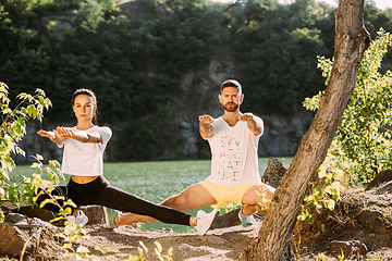 Image showing Young couple having fun and spending time at riverside in sunny day