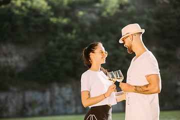 Image showing Young couple having fun and spending time at riverside in sunny day