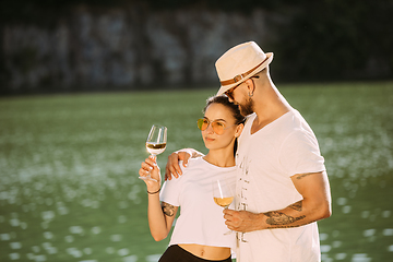 Image showing Young couple having fun and spending time at riverside in sunny day