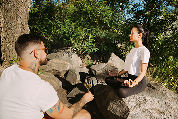 Image showing Young couple having fun and spending time at riverside in sunny day