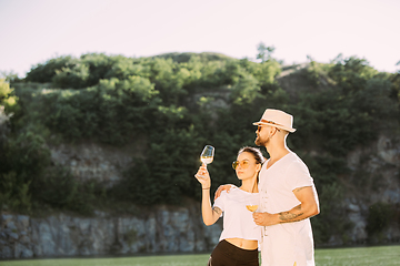 Image showing Young couple having fun and spending time at riverside in sunny day