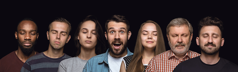 Image showing Close up portrait of young people isolated on black studio background