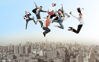 Image showing Office workers or ballet dancers jumping above the city