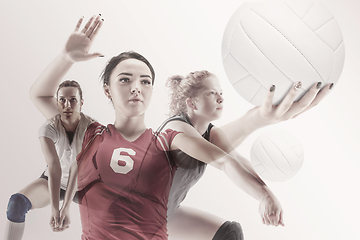 Image showing Young female volleyball player isolated on white studio background