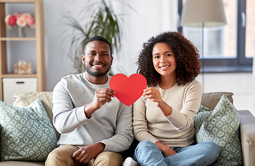 Image showing happy african american couple with heart at home