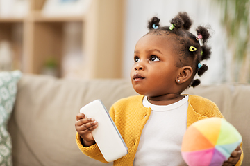 Image showing african american baby girl with smartphone at home