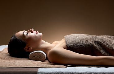 Image showing young woman lying at spa or massage parlor